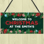 Welcome Christmas Sign At The 'Surname' Personalised Decoration