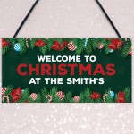 Welcome Christmas Sign At The 'Surname' Personalised Decoration