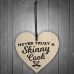 Never Trust A Skinny Cook Novelty Wooden Hanging Heart Plaque